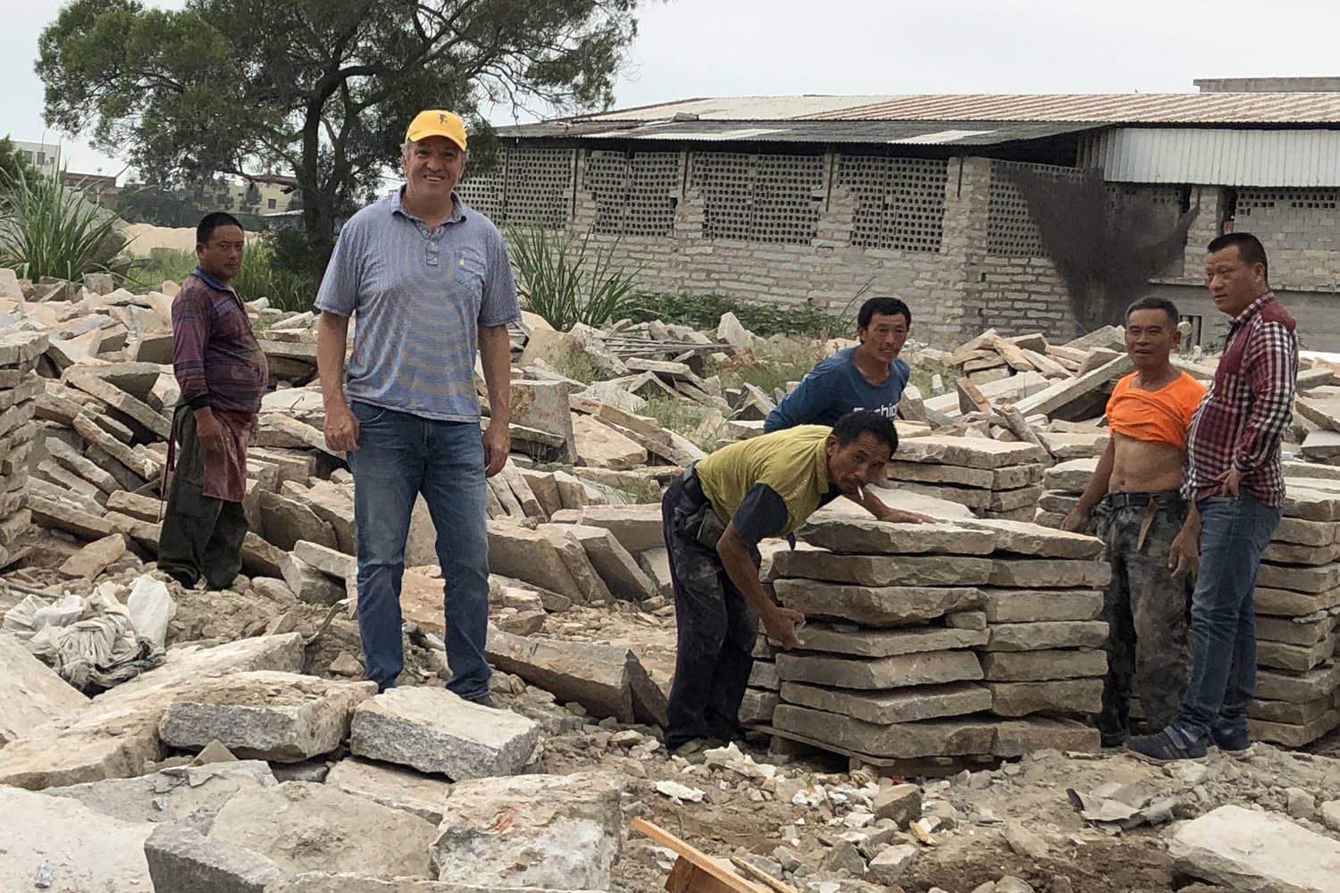 Gavin and workers in Chinese stone yard