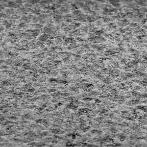 Brushed natural stone surface finish example in grayscale