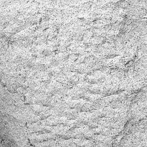 Chiseled natural stone surface finish example in grayscale