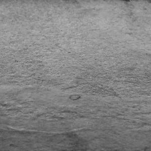 Leathered natural stone surface finish example in grayscale