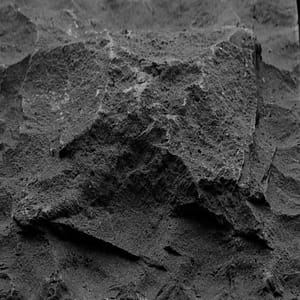 Pillowed natural stone surface finish example in grayscale