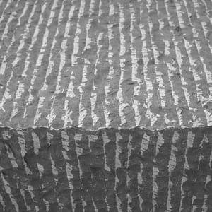 Point Stalk natural stone surface finish example in grayscale