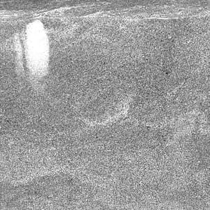 Sawn natural stone surface finish example in grayscale