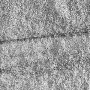 Split-face natural stone surface finish example in grayscale