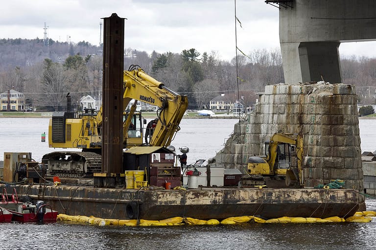 Excavating bridge blocks from old bridge