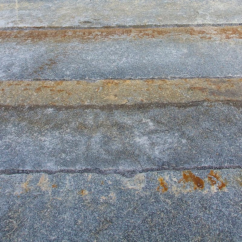 Reclaimed-third-generation-granite-curbstone-plank-paver-closeup