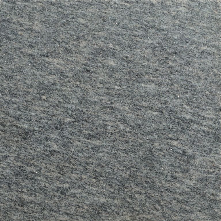 Color/Finish variation image for Brazilian Lucerna Gneiss. The surface finish shown is brushed. The dominant color shown is gray. The color mix creates a cool feeling.
