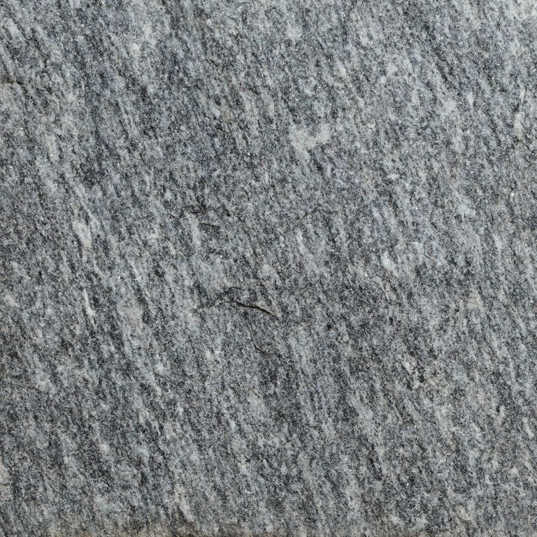 Color/Finish variation image for Brazilian Lucerna Gneiss. The surface finish shown is split-face. The dominant color shown is gray. The color mix creates a cool feeling.