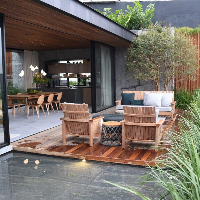 Feature image for Brazilian Lucerna Gneiss. The image shows this material being used in a patio pavers application. The surface finish shown is flamed. The dominant color shown is gray. The color mix creates a cool feeling.