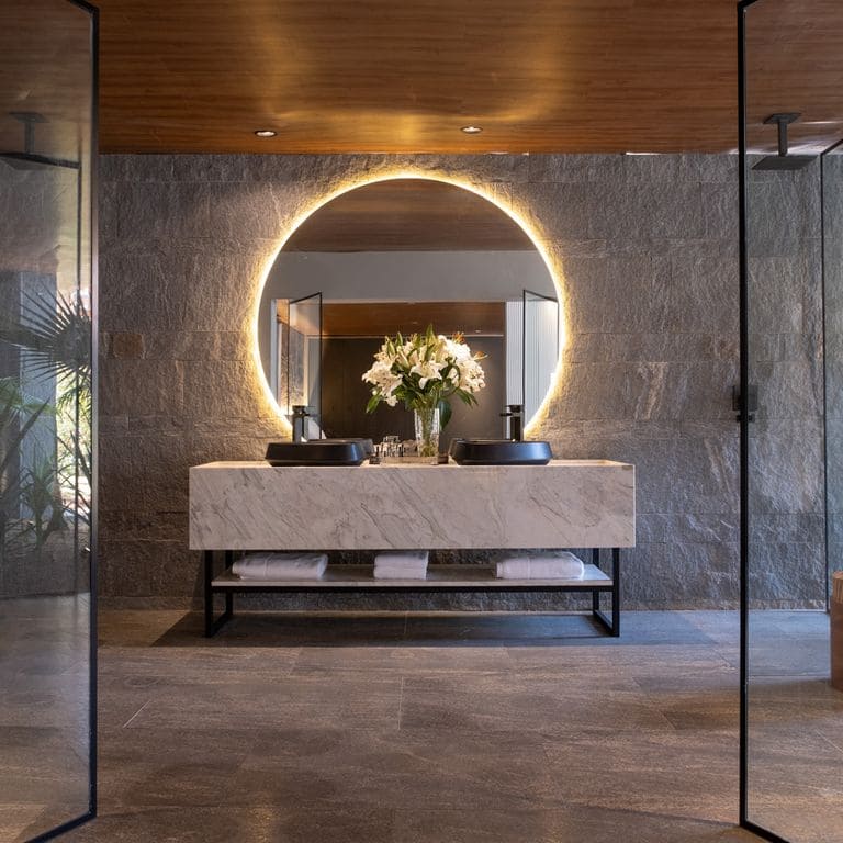 Application image for Brazilian Lucerna Gneiss. The image shows this material being used in an interior cladding application. The surface finish shown is split-face. The dominant color shown is gray. The color mix creates a cool feeling.