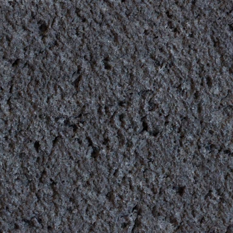 Color/Finish variation image for Basalt - Basalto. The surface finish shown is waterjet. The dominant color shown is black; with green, purple and tan secondaries. The color mix creates a warm feeling. Solid color pattern. Contains voids.