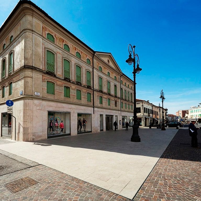 Application image for Limestone - Veneto Rosato. The image shows this material being used in a public area application. The surface finish shown is flamed. Dominant colors shown are beige and cream.