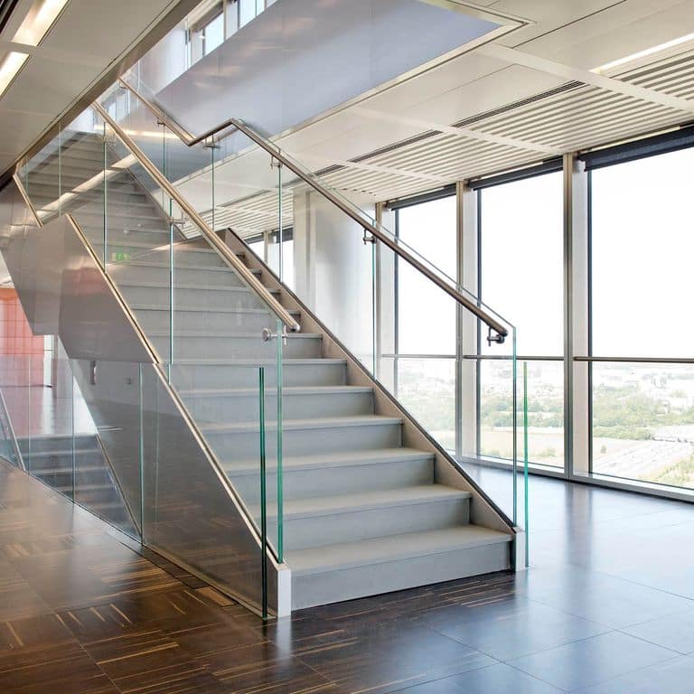 Application image for Pietra Forte Fiorentina Sandstone. The image shows this material being used for treads and thin veneer. Dominant colors shown are blue and gray. The color mix creates a cool feeling. Solid color pattern.