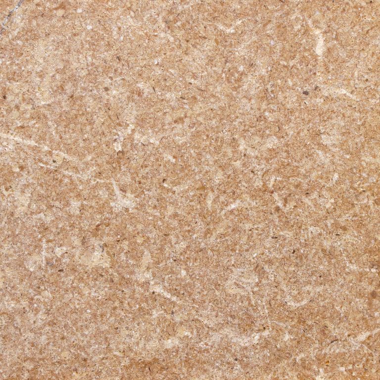 Color/Finish variation image for Marble - Golden Sinai. The surface finish shown is tumbled. Dominant colors shown are beige, orange/rust and tan. The color mix creates a warm feeling. Speckled and random color patterns.