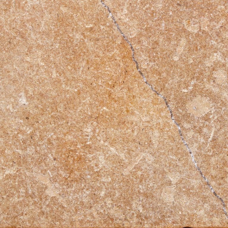 Best close-up image for Golden Sinai Marble. The surface finish shown is tumbled. Dominant colors shown are beige, orange/rust and tan. The color mix creates a warm feeling. Cloudy color pattern.