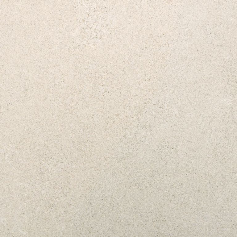 Best close-up image for Variegated Limestone. The surface finish shown is honed. Dominant colors shown are beige and cream. The color mix creates a warm feeling. Regular color pattern.