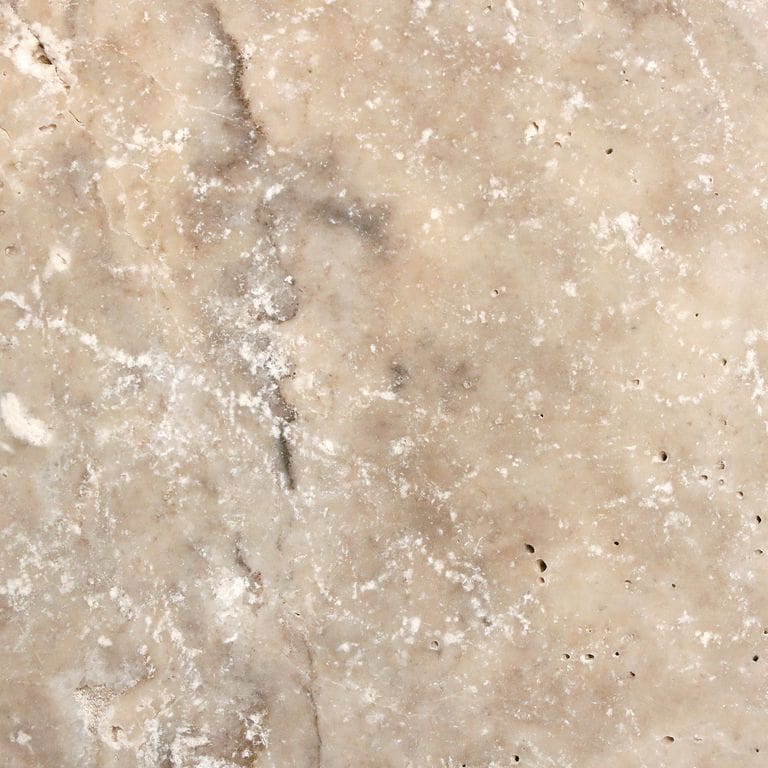 Feature image for Silver Travertine. The surface finish shown is tumbled. Dominant colors shown are beige and tan. The color mix creates a warm feeling. Random color pattern. Contains voids.