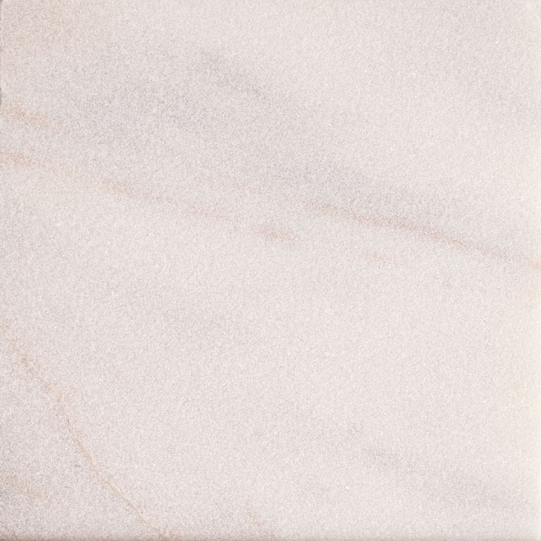 Best close-up image for Marble - Rosa Aurora. The surface finish shown is sand blasted. Dominant colors shown are pink and white. Exhibits "movement" and the color mix creates a warm feeling. Marbled color pattern.