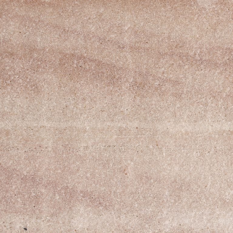 Color/Finish variation image for Harvest Gold Sandstone. The surface finish shown is flamed. Dominant colors shown are beige, pink and tan. Exhibits "movement" and the color mix creates a warm feeling. Linear color pattern.