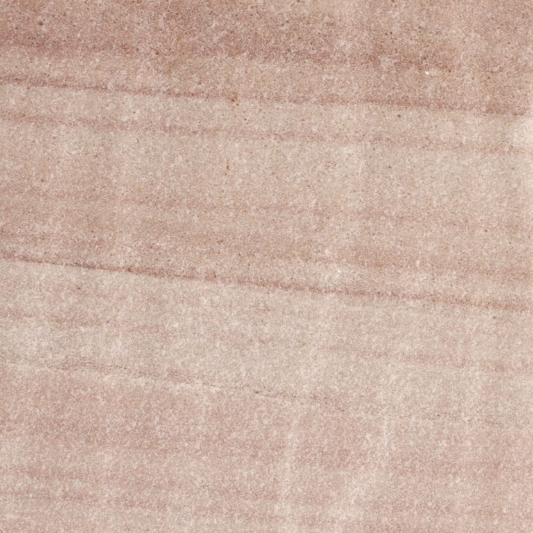 Best close-up image for Harvest Gold Sandstone. The surface finish shown is flamed. Dominant colors shown are beige, pink and tan. Exhibits "movement" and the color mix creates a warm feeling. Linear color pattern.