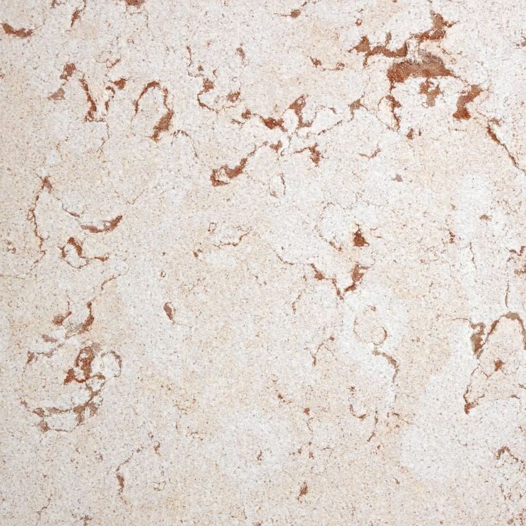 Best close-up image for Limestone - Coral. The surface finish shown is sand blasted. Dominant colors shown are beige and cream. Exhibits "movement" and the color mix creates a warm feeling. Swirled color pattern.