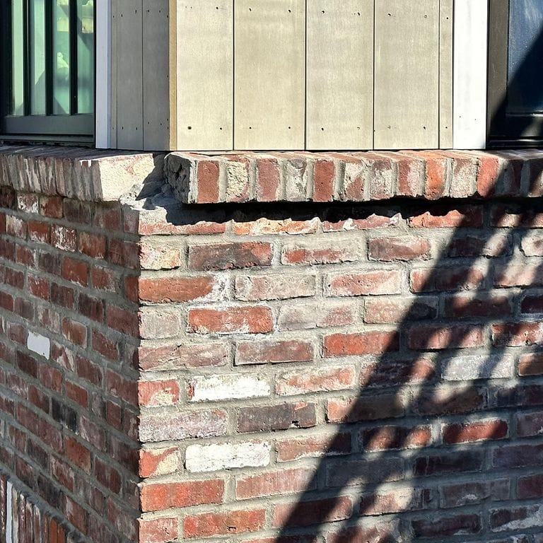 Application image for Reclaimed Rail Station Brick. The image shows this material being used for full bed veneer and thin veneer. The surface finish shown is . Dominant colors shown are brown, gray, red and white. The color mix creates a warm feeling. Regular color pattern.