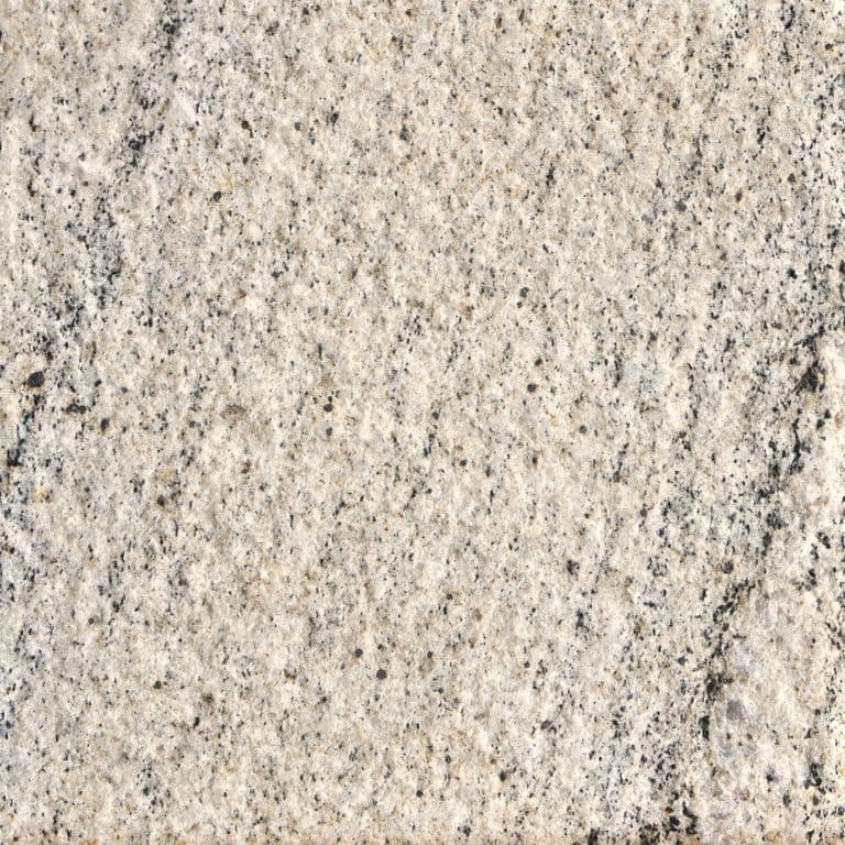 Feature image for Tanex Granite. The surface finish shown is sand blasted. The dominant color shown is beige. The color mix creates a warm feeling. Streaked and fine speckled color patterns.