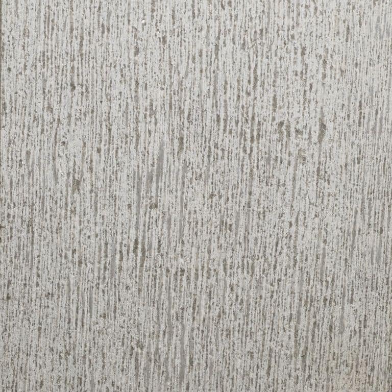 Color/Finish variation image for Northern Bay Limestone. The surface finish shown is adze. The dominant color shown is gray. The color mix creates a cool feeling. Linear color pattern.