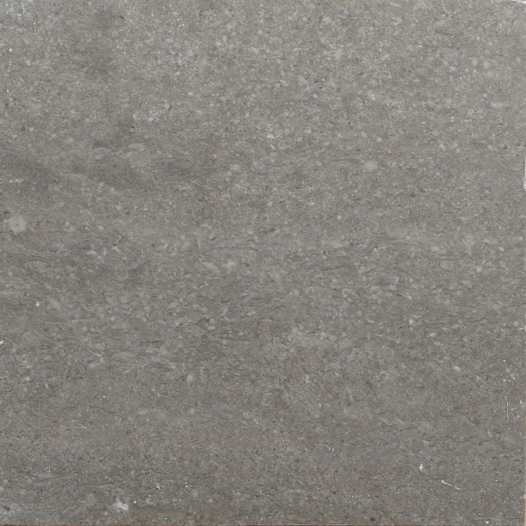 Color/Finish variation image for Northern Bay Limestone. The surface finish shown is honed. The dominant color shown is gray. Blotched color pattern.