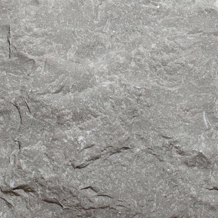 Color/Finish variation image for Northern Bay Limestone. The surface finish shown is split-face. The dominant color shown is gray. The color mix creates a cool feeling.