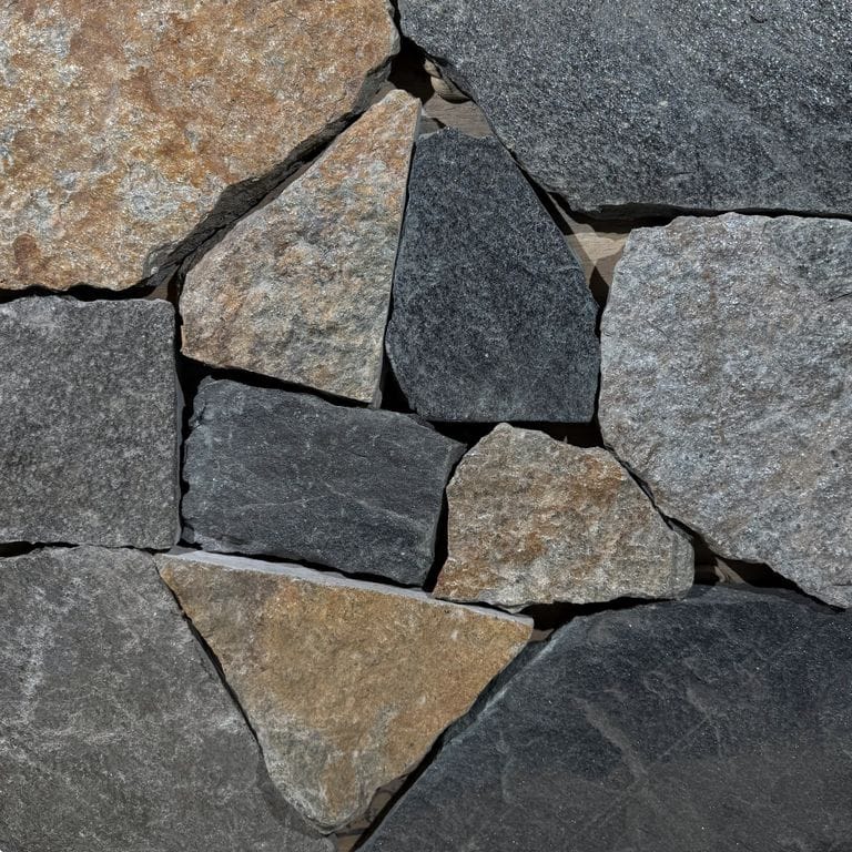 Color/Finish variation image for Vermont Granite Blend. The surface finish shown is split-face. Dominant colors shown are brown, gray and tan. The color mix creates a warm feeling.