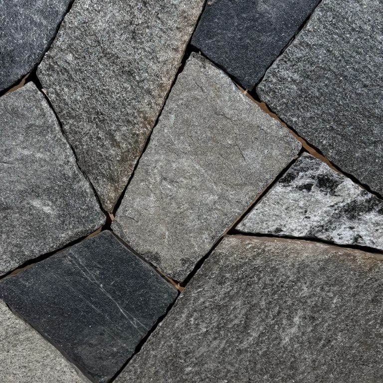 Color/Finish variation image for Windsor Granite Thin Veneer. The surface finish shown is split-face. Dominant colors shown are black and gray.