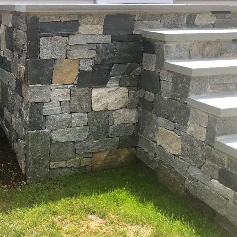 Application image for Windsor Granite Thin Veneer. The image shows this material being used in a thin veneer application. The surface finish shown is . The dominant color shown is gray. The color mix creates a warm feeling. Regular, streaked and random color patterns.