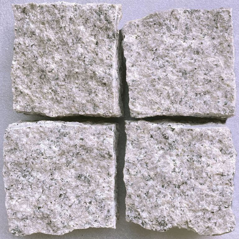 Feature image for Oriental Blush Granite. The surface finish shown is split-face with flat plane. Dominant colors shown are gray and pink. The color mix creates a cool feeling. Fine speckled color pattern.