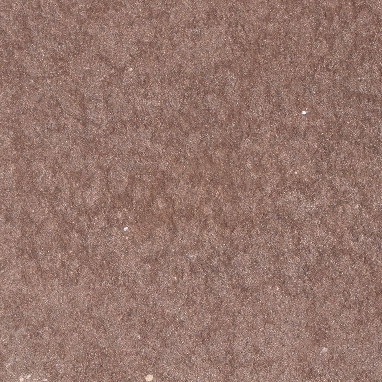 Feature image for Terra Red Sandstone. The surface finish shown is sand blasted. Dominant colors shown are orange/rust and red. The color mix creates a warm feeling. Blotched color pattern.