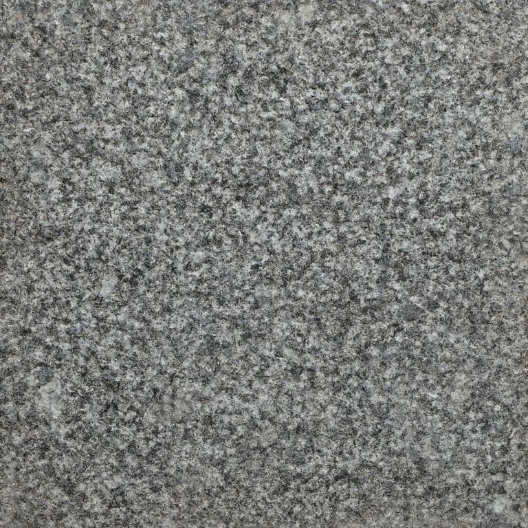 Color/Finish variation image for Pensy Black Granite. The surface finish shown is bush hammered. The dominant color shown is gray. The color mix creates a cool feeling.