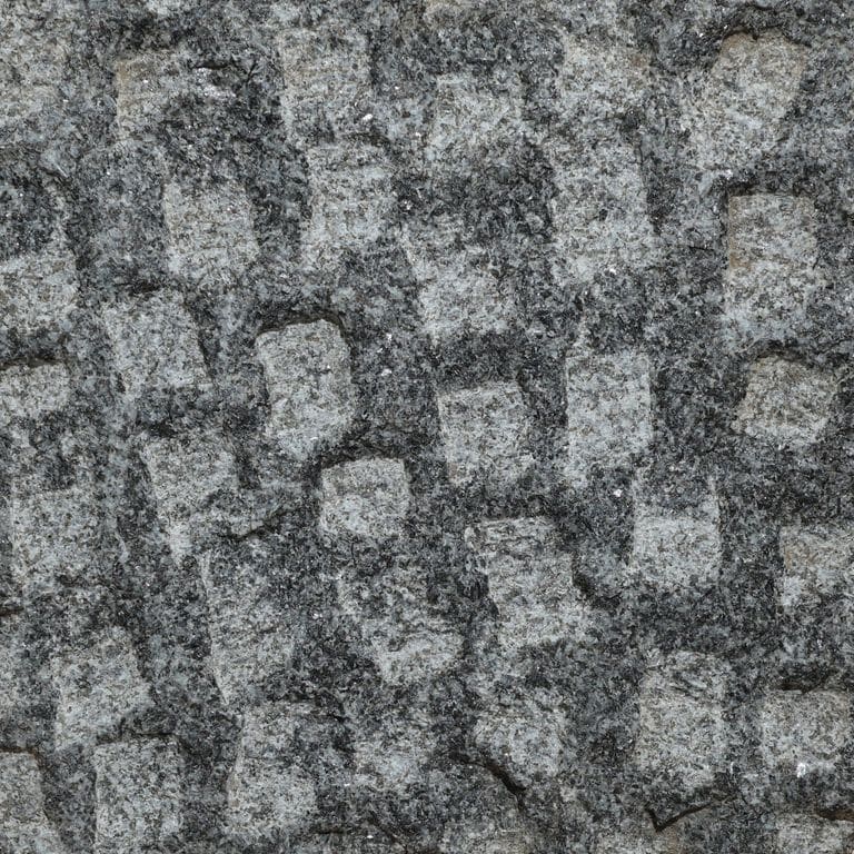 Color/Finish variation image for Pensy Black Granite. The surface finish shown is pineapple. The dominant color shown is gray. The color mix creates a cool feeling.