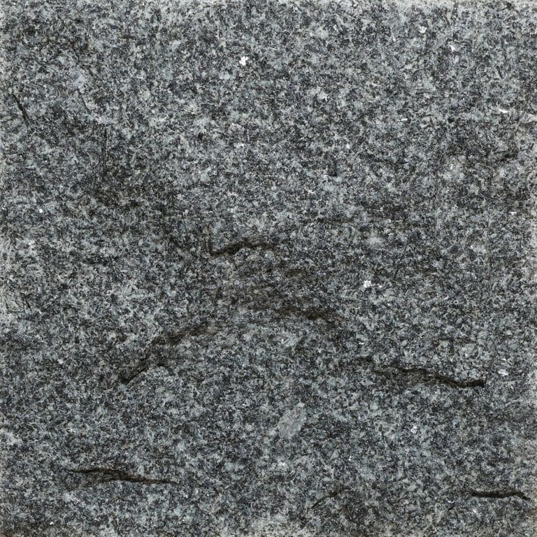 Color/Finish variation image for Pensy Black Granite. The surface finish shown is split-face. The dominant color shown is gray. The color mix creates a cool feeling.