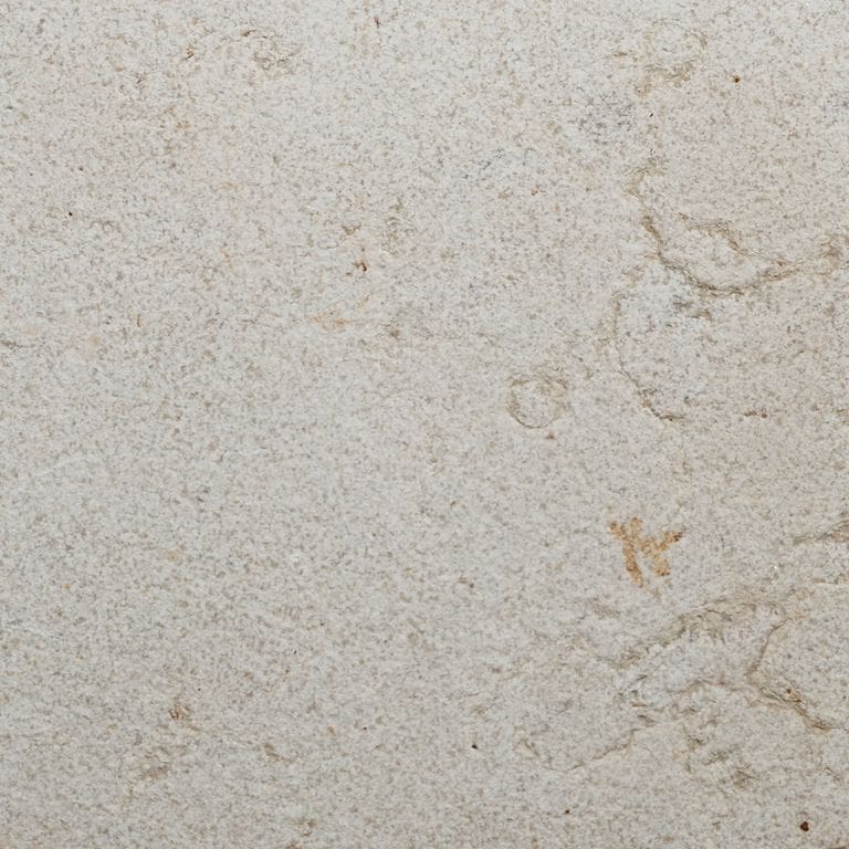 Color/Finish variation image for Moon Beige Limestone. The surface finish shown is sand blasted. Dominant colors shown are beige, white and cream. The color mix creates a warm feeling.