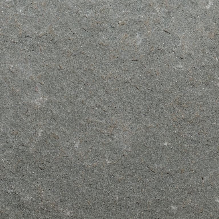 Color/Finish variation image for Moon Gray Limestone. The surface finish shown is flamed. The dominant color shown is gray. The color mix creates a cool feeling.