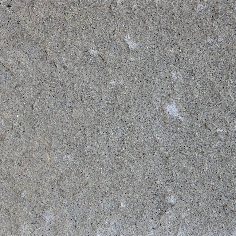 Best close-up image for Italian Forte Bluestone. The surface finish shown is flamed. The dominant color shown is gray. The color mix creates a cool feeling. Regular color pattern.