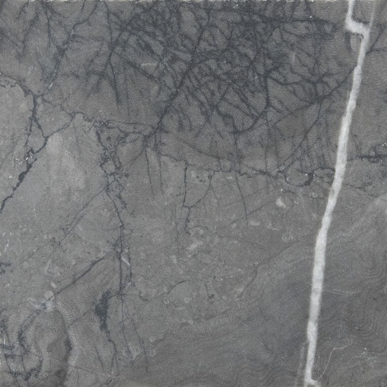 Feature image for Limestone - Marrakesh. The surface finish shown is brushed. The dominant color shown is gray. Exhibits "movement" and the color mix creates a cool feeling. Veined color pattern.