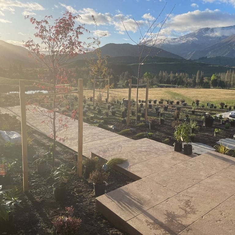 Feature image for Limestone - Rabat Beige. The image shows this material being used in a path pavers application. Dominant colors shown are brown, gray and tan. The color mix creates a warm feeling.