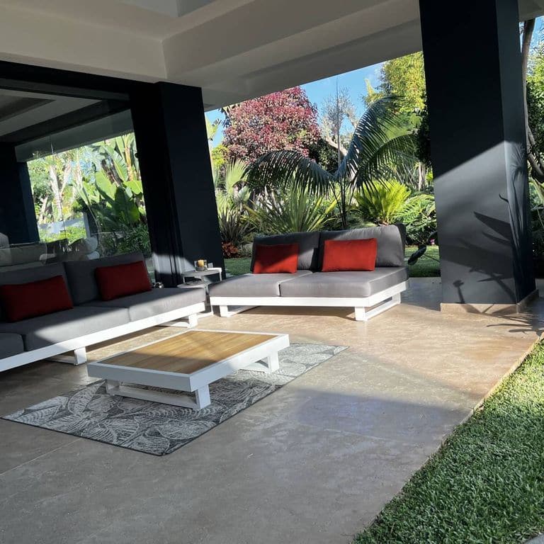 Application image for Limestone - Rabat Beige. The image shows this material being used in a patio pavers application. The surface finish shown is brushed. Dominant colors shown are gray and tan. The color mix creates a warm feeling.