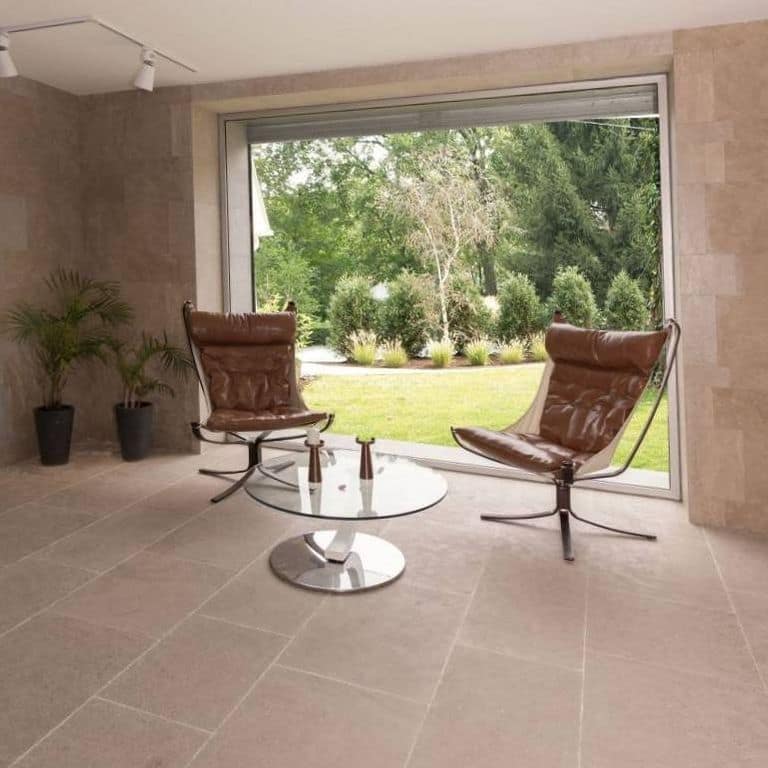 Application image for Limestone - Rabat Beige. The image shows this material being used in an interior floor application. The surface finish shown is sand blasted. Dominant colors shown are brown and tan. The color mix creates a warm feeling.