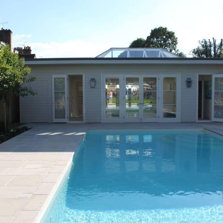 Feature image for Limestone - Meknes Beige. The image shows this material being used for pool coping and pool deck pavers. The surface finish shown is antiqued. Dominant colors shown are beige, tan and cream. The color mix creates a warm feeling.