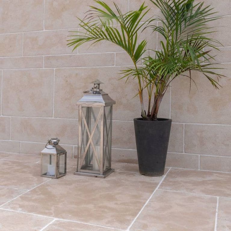 Application image for Limestone - Meknes Beige. The image shows this material being used for patio pavers and thin veneer. Dominant colors shown are gray and tan. The color mix creates a warm feeling.