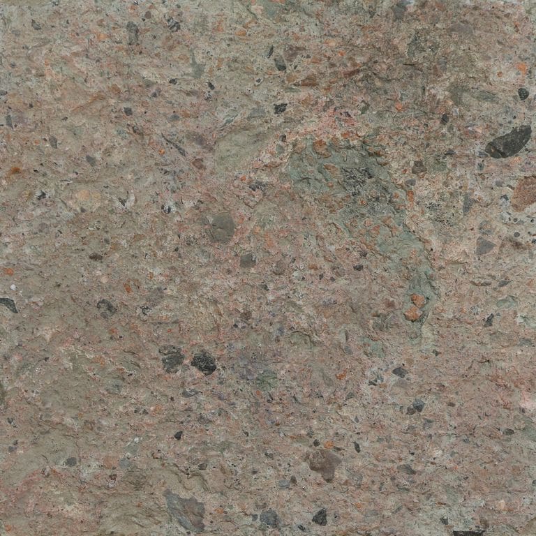Color/Finish variation image for Reclaimed Tuff Stone. The surface finish shown is split-face. Dominant colors shown are brown and gray. The color mix creates a warm feeling.