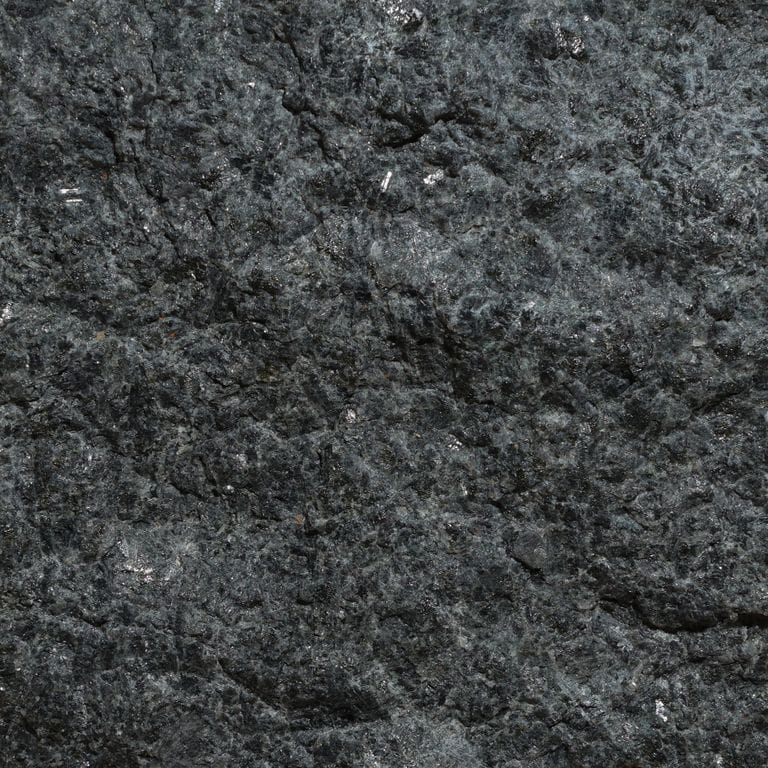 Color/Finish variation image for Terra Black Granite. The surface finish shown is split-face. Dominant colors shown are black and gray. The color mix creates a cool feeling.