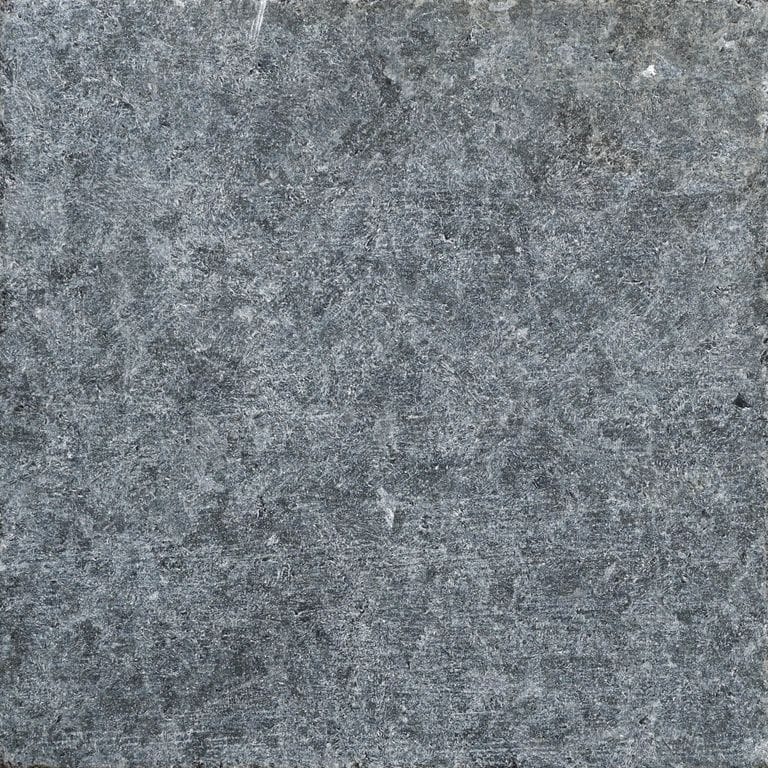 Color/Finish variation image for Terra Black Granite. The surface finish shown is tumbled. The dominant color shown is gray. The color mix creates a cool feeling. Blotched color pattern.